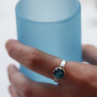 Ivy Ring being worn holding a glass.