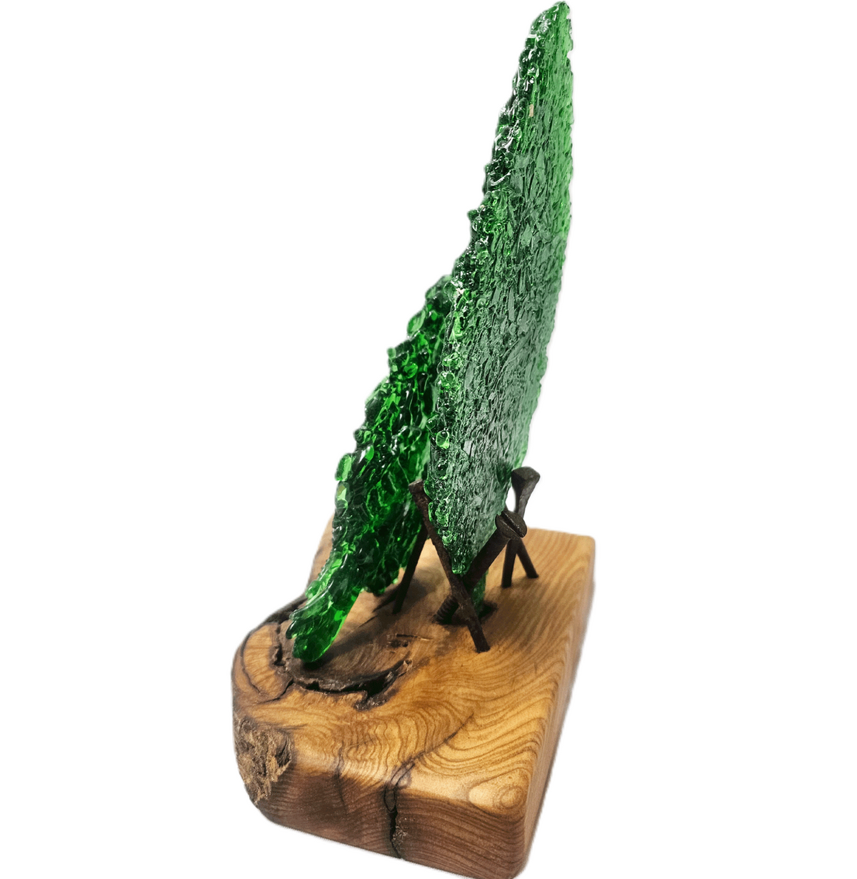 Side view of two fused green glass leaf sculptures displayed on a single oiled piece of Australian Bush timber with natural wood grain, supported by aged metal nails and isolated on a white background.